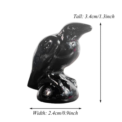 Black bird figurine with measurements on a white background