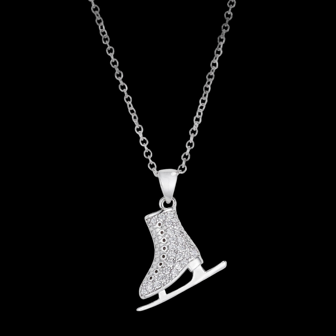 Silver ice skate pendant necklace on a white background