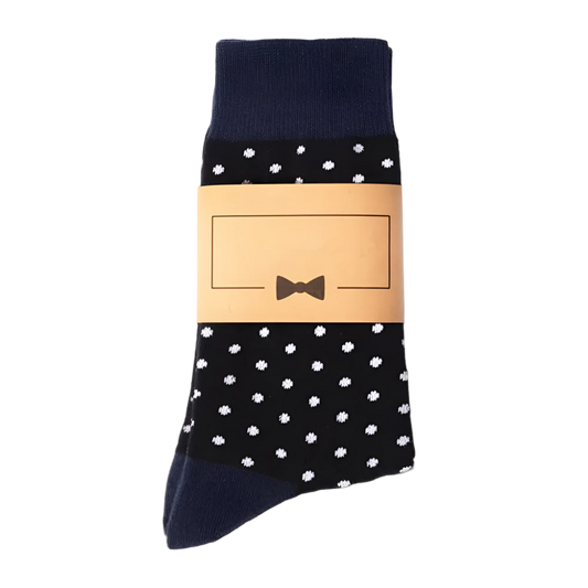 Black socks with white polka dots and a beige label on a white background