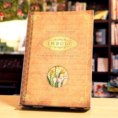 Book titled 'IMBOLC' with decorative cover on a table