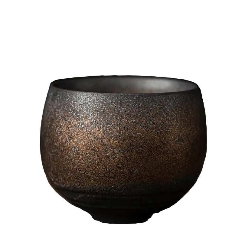Ceramic cup with a textured surface on a dark background