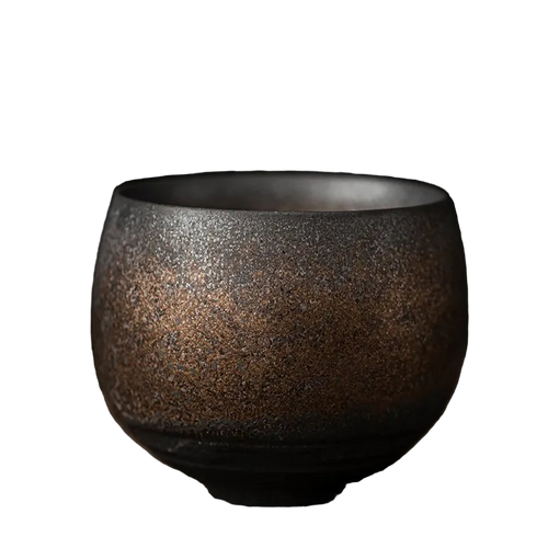 Ceramic cup with a textured surface on a dark background