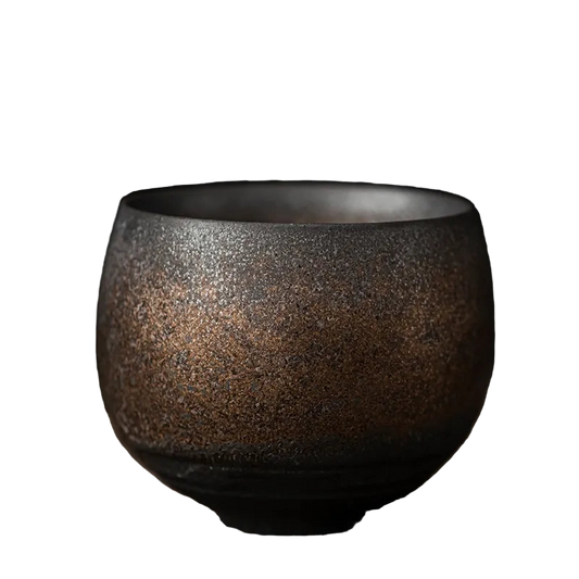 Ceramic cup with a textured surface on a dark background