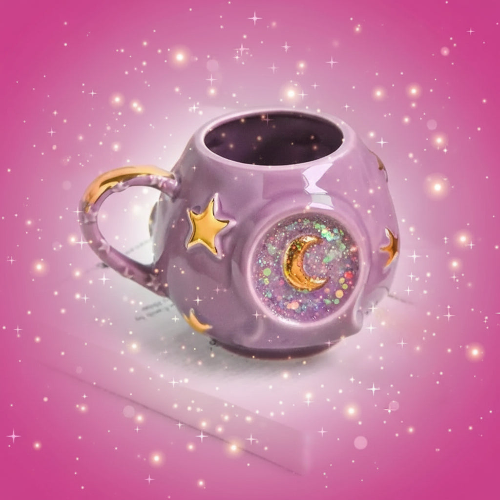 Purple mug with star and moon designs on a white surface