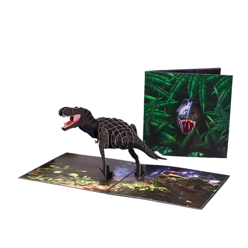 Dinosaur model and pop-up book with jungle scene on a white background