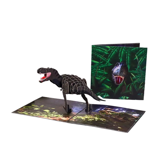 Dinosaur model and pop-up book with jungle scene on a white background