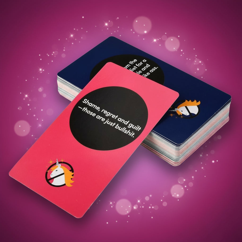 Stack of playing cards with a pink card featuring text and a logo.