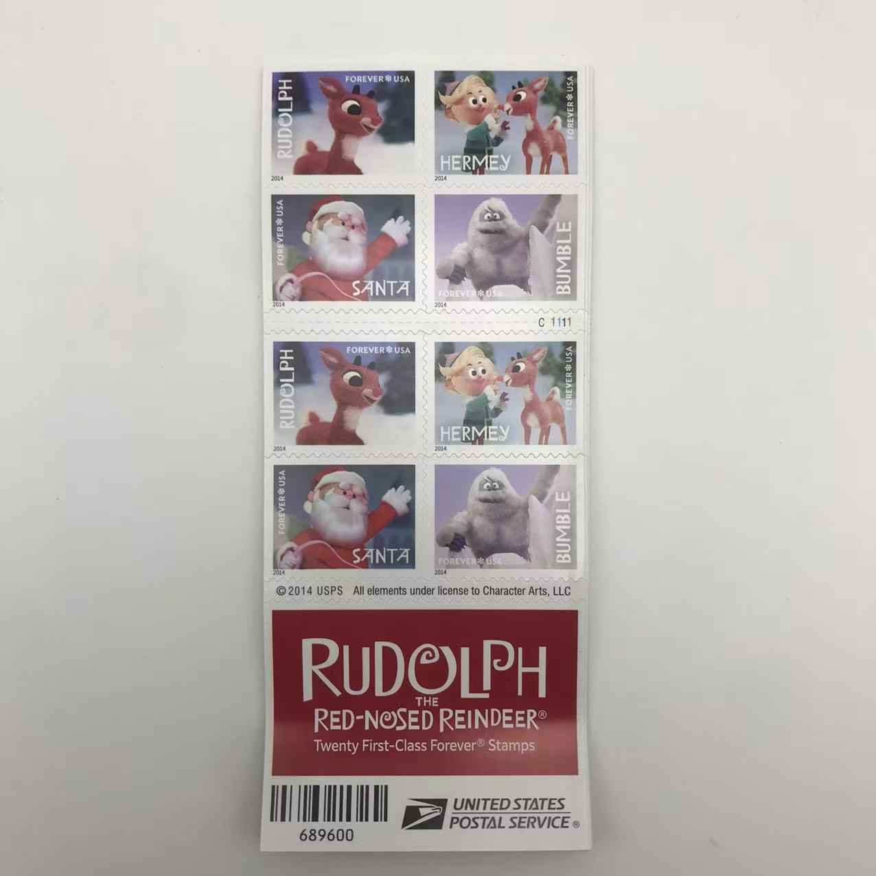 Sheet of Rudolph the Red-Nosed Reindeer stamps with characters on a white background