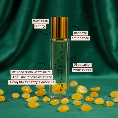 Perfume bottle labeled with scents and their effects, surrounded by yellow stones on a white background