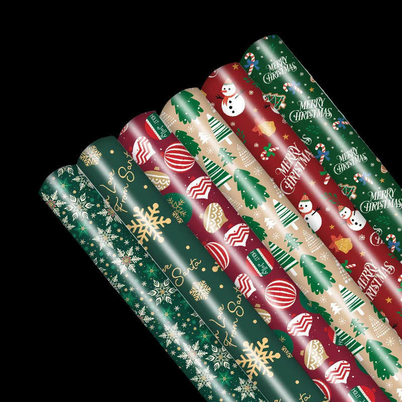 Set of Christmas-themed wrapping paper rolls on a white background