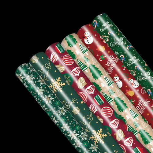 Set of Christmas-themed wrapping paper rolls on a white background