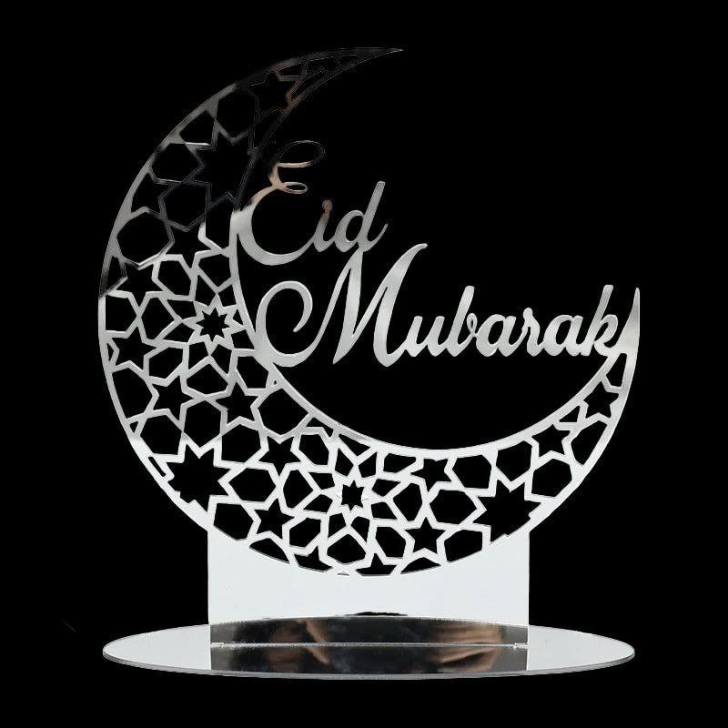 Decorative metal sign with 'Eid Mubarak' on a white background