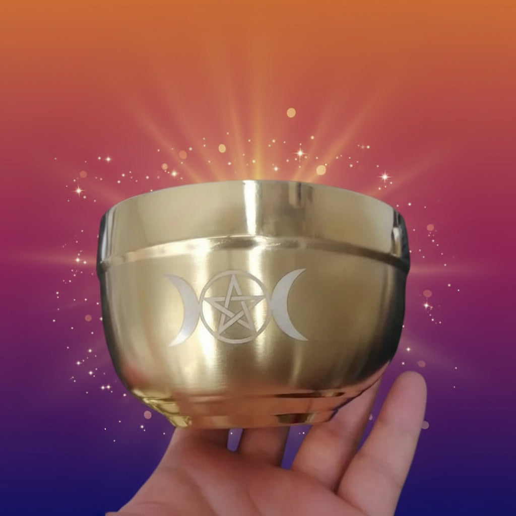 Gold container with a symbol held in front of a computer screen