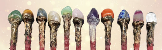 Set of decorative hair sticks with colorful tops on a white background