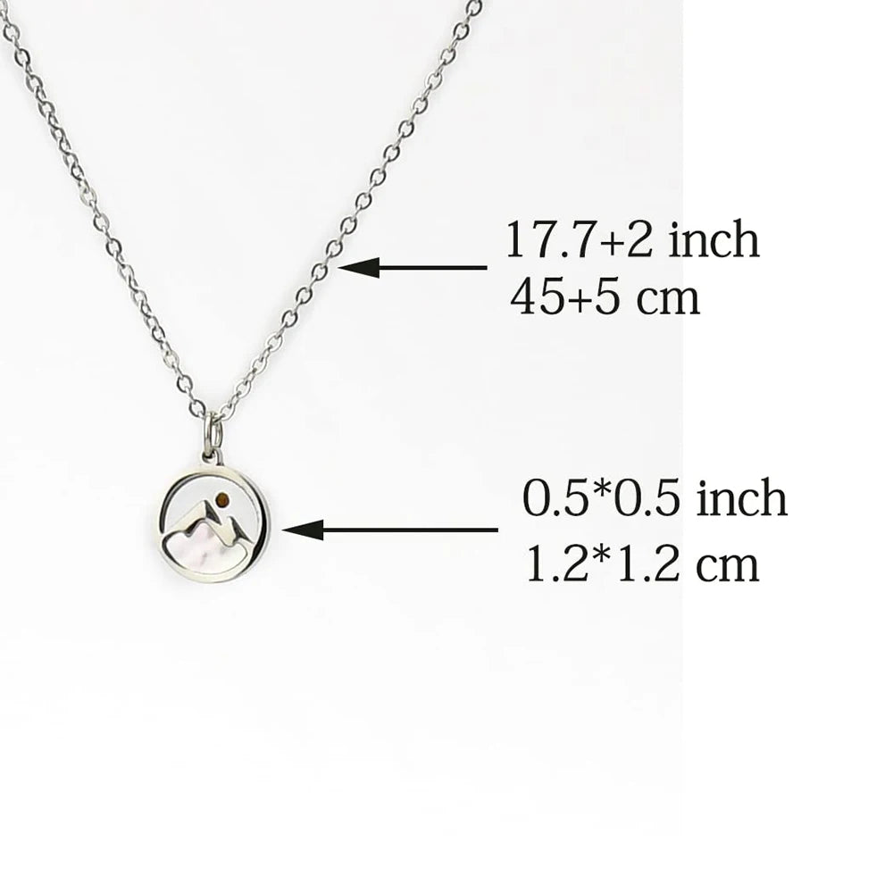 Silver necklace with a round pendant, measurements indicated on a white background