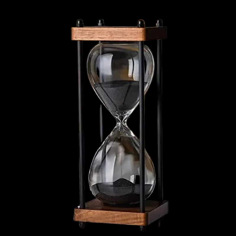 Hourglass with wooden frame on a blurred background