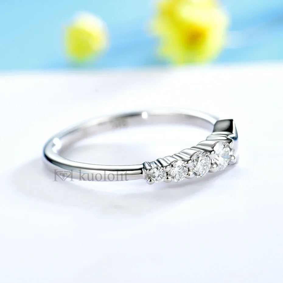 Silver ring with diamonds on a light background