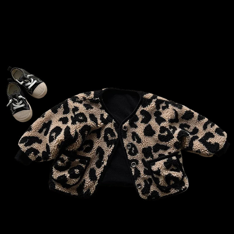 Leopard print jacket and black sneakers on a white background