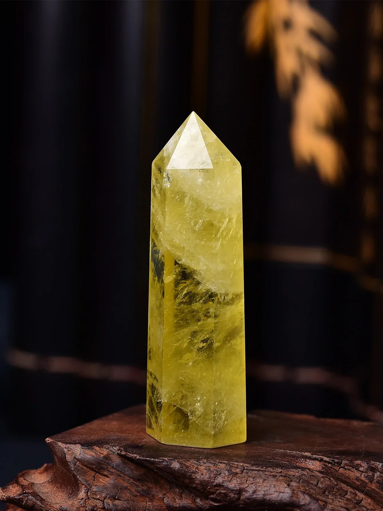 Yellow crystal pyramid on a dark background