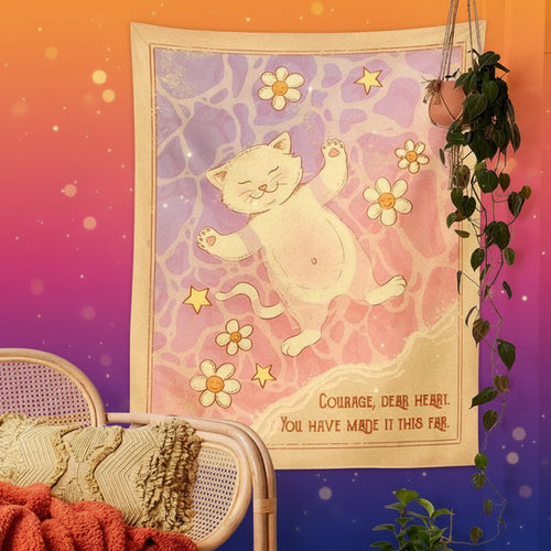 Poster with a cat illustration and motivational quote on a wall with a chair and plants.