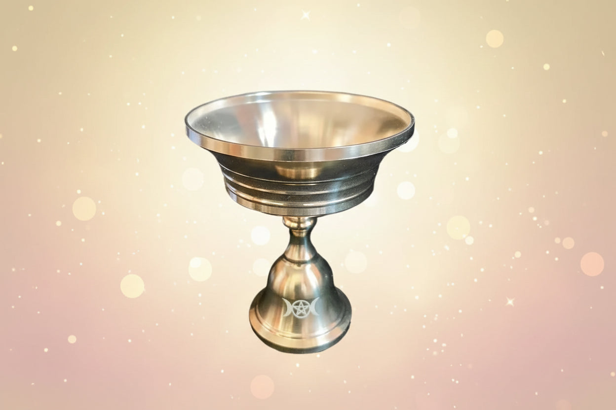 Metallic bowl with a pedestal base on a white background