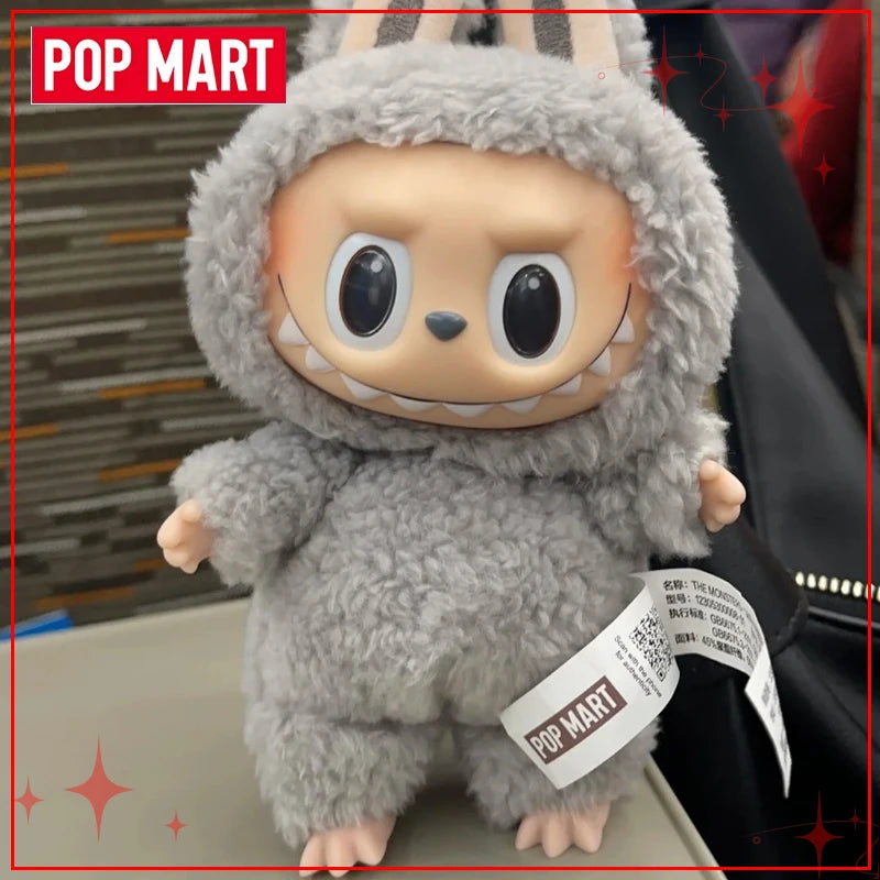 Plush toy with a tag displaying 'Pop Mart' on a blurred background
