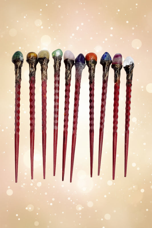 Set of magical wands with colored tops on a white background