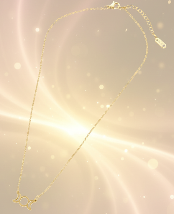 Gold necklace with a small pendant on a white background