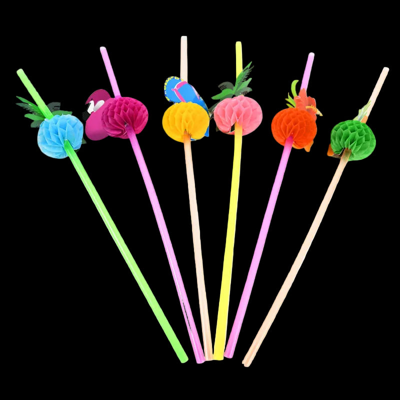 Colorful straw toppers with pineapple, bird, and flower designs on a white background