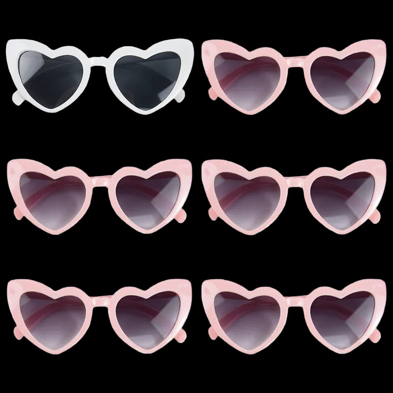 Heart-shaped sunglasses in various colors on a white background