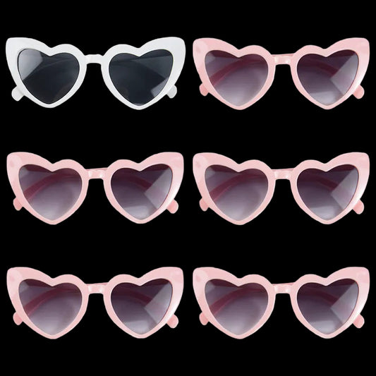 Heart-shaped sunglasses in various colors on a white background