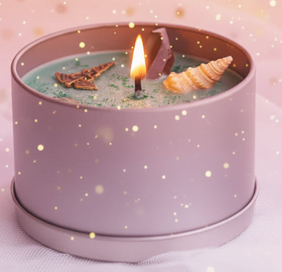 Candle in a gray container with decorative elements on a light background