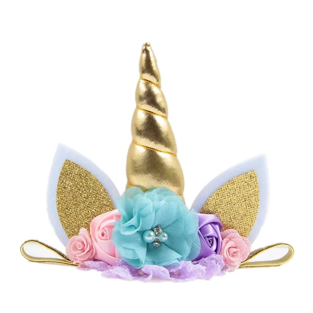 Unicorn headband with gold horn, flowers, and ears on a white background