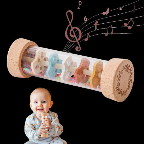 Wooden toy with musical notes and a baby holding the toy