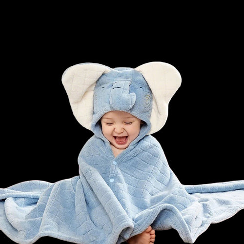 Baby wearing a blue hooded towel with elephant ears, featuring the Aibedila brand.
