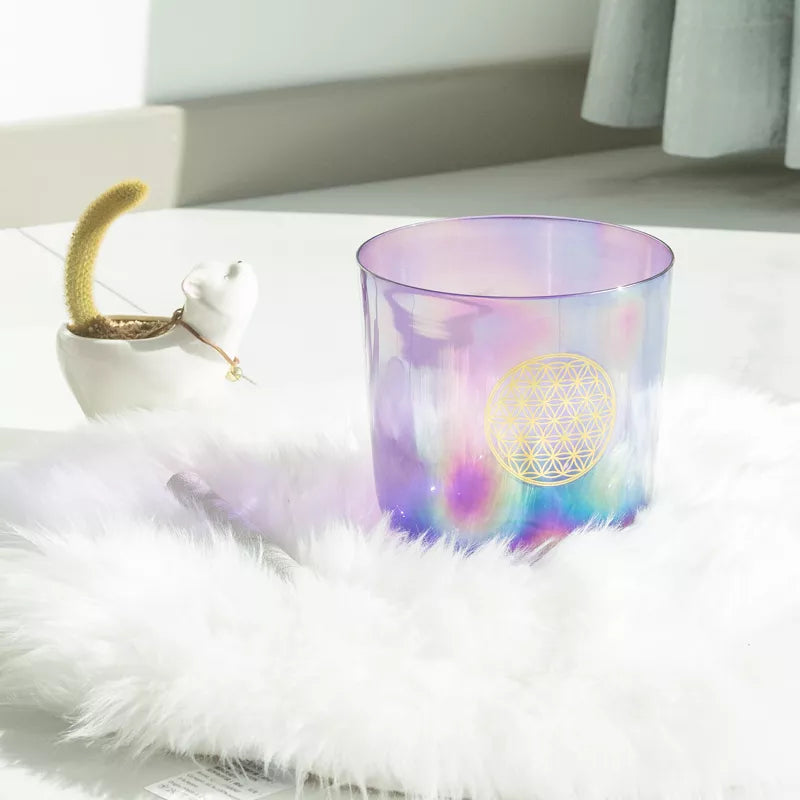 Colorful glass with a geometric design on a white surface