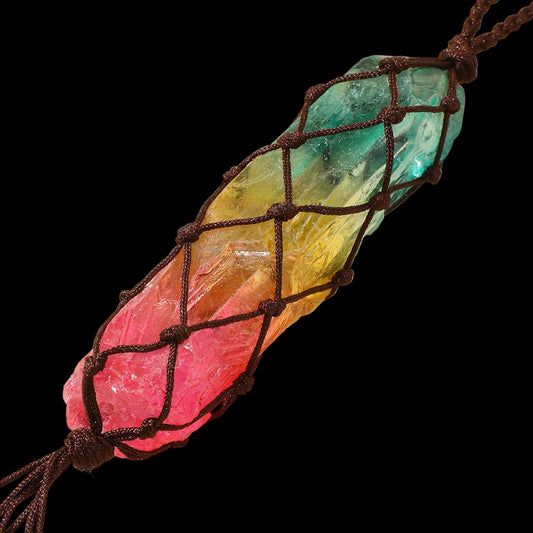 Colorful crystal pendant with a rope on a beige background