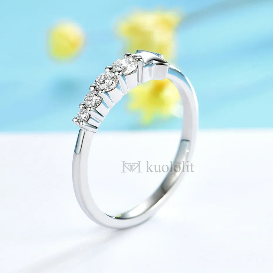 Silver ring with diamonds on a light blue background