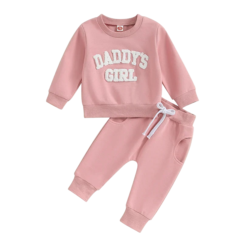 Pink children's sweatshirt and pants set with 'DADDY'S GIRL' text on a white background