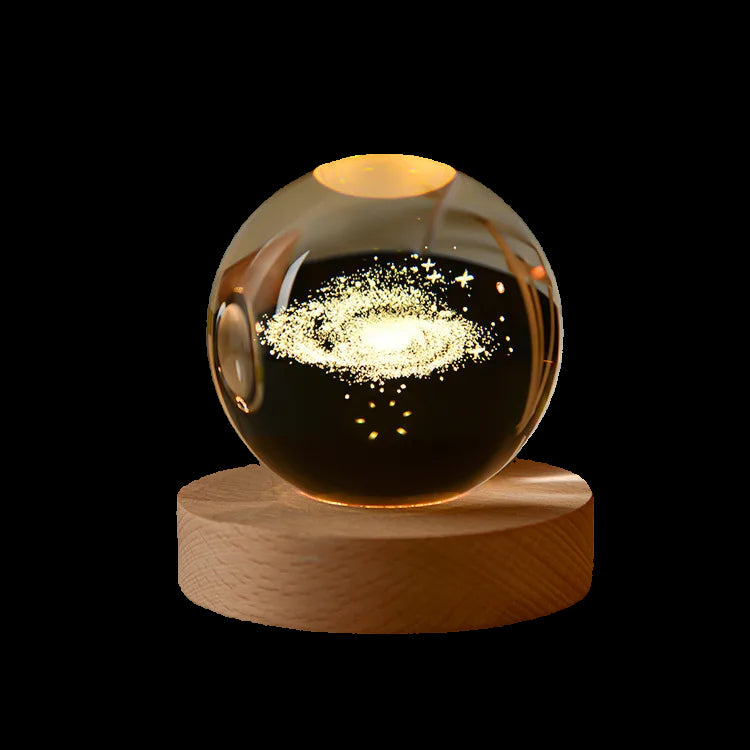 Glass orb with glowing interior on a wooden base against a dark background
