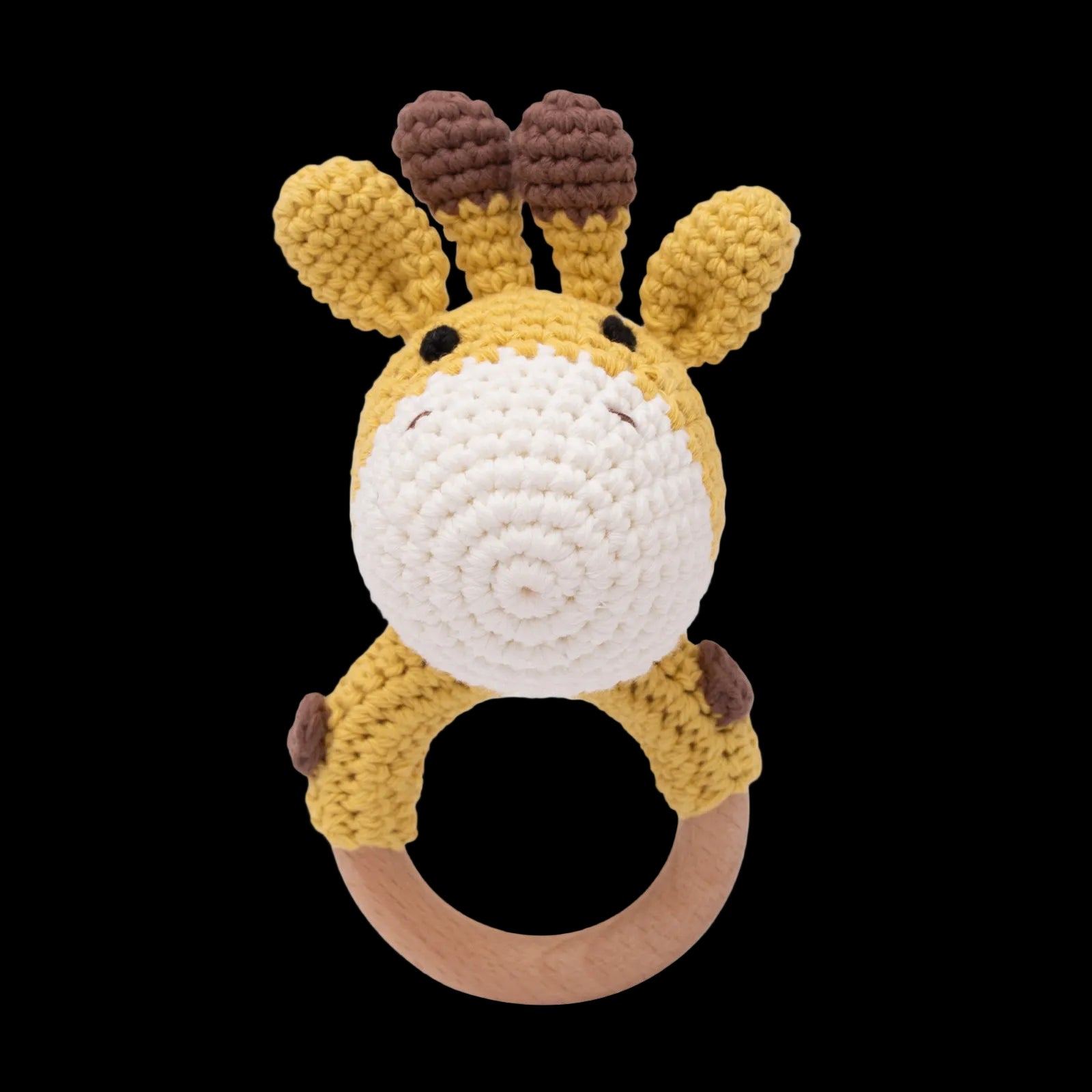 Crocheted giraffe rattle toy on a white background
