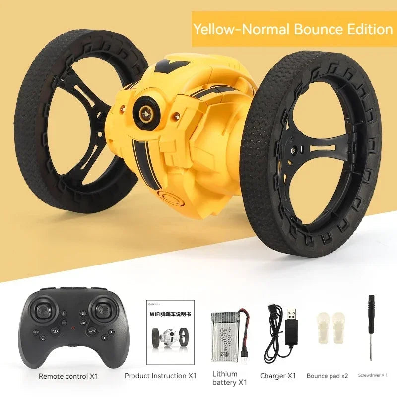 Yellow remote-controlled vehicle with wheels and accessories on a beige background