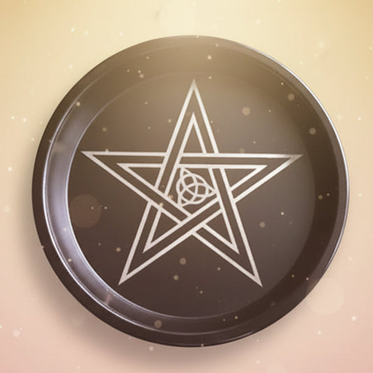 Decorative item with a pentagram design on a dark background