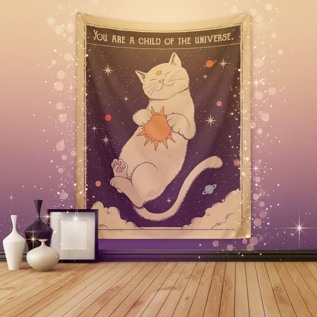 Tapestry with a cat holding the sun and 'You are a child of the universe' text, hanging on a wall.