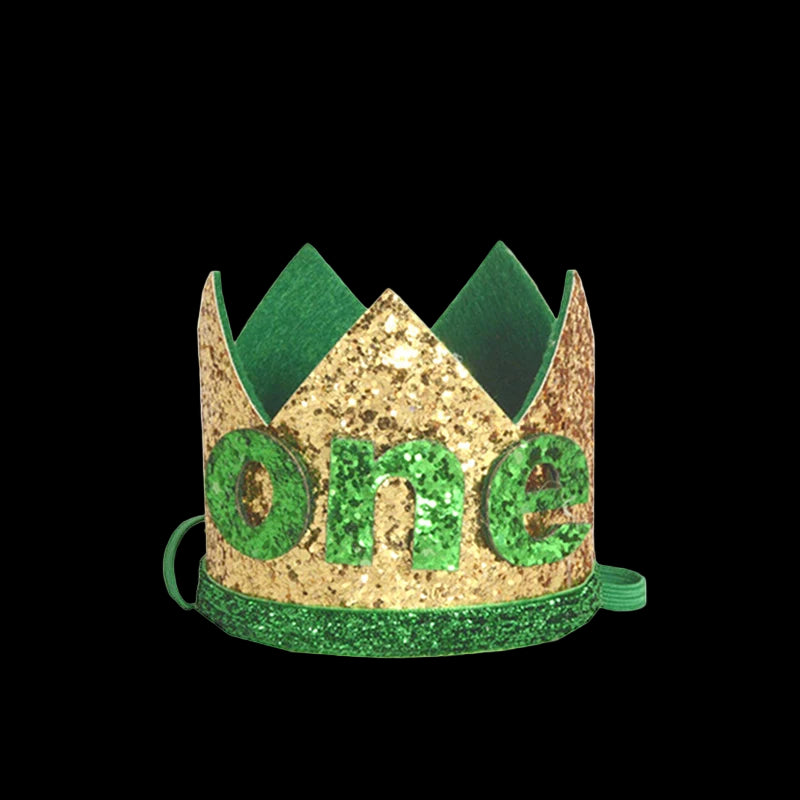 Gold and green birthday crown with 'one' on a white background