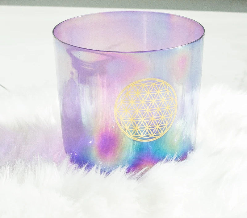 Pastel-colored glass with a geometric design on a white surface