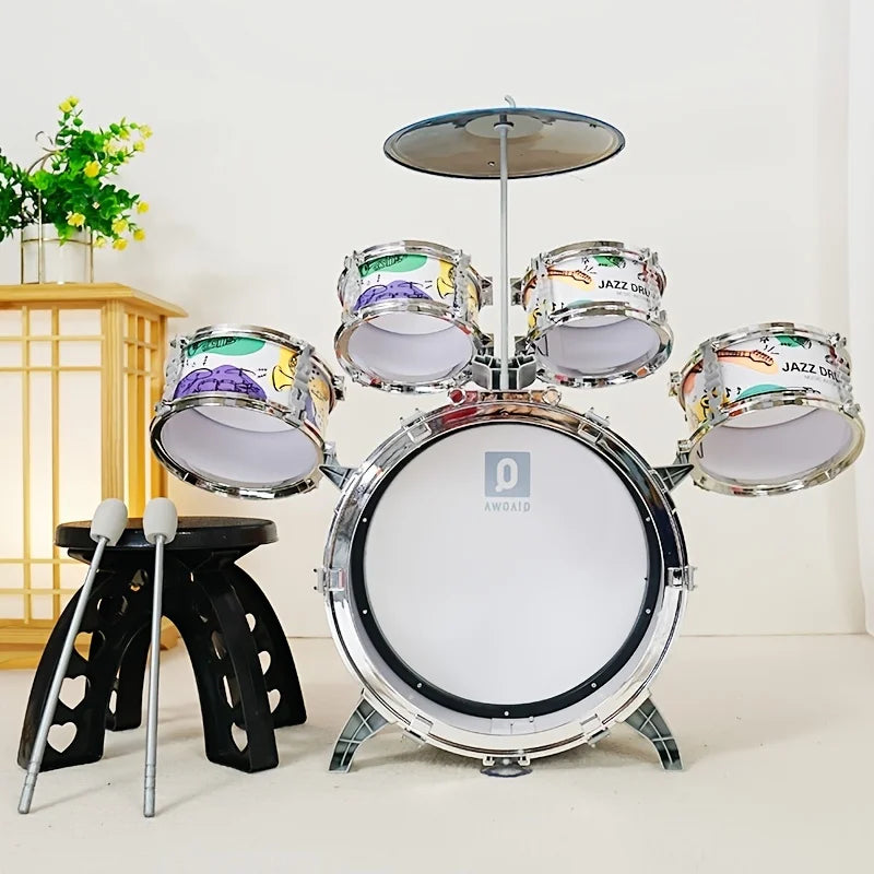 Children's drum set with drums and cymbal on a white background