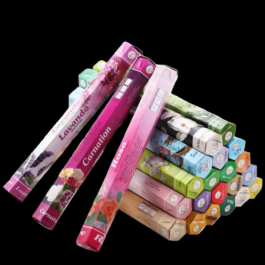 Stack of colorful incense boxes with visible brand names on a white background