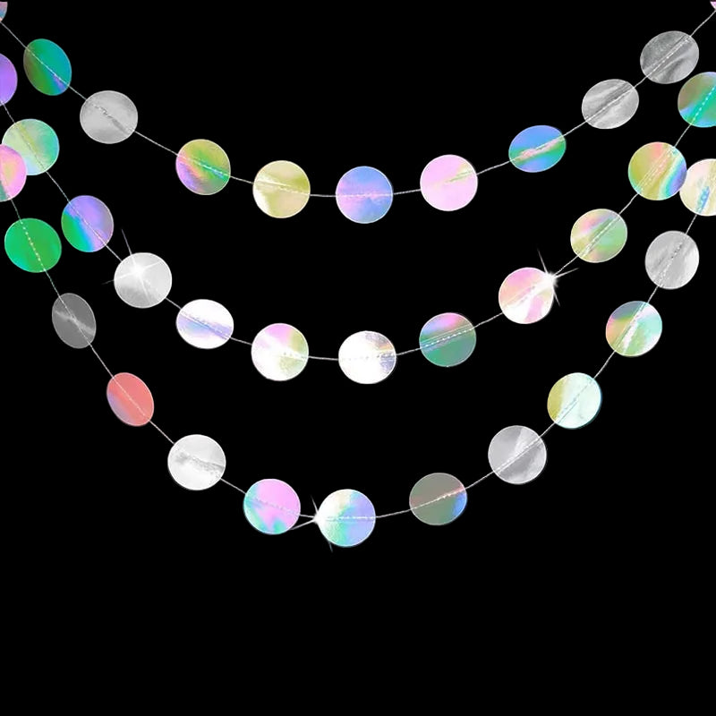 Iridescent round confetti garland on a black background