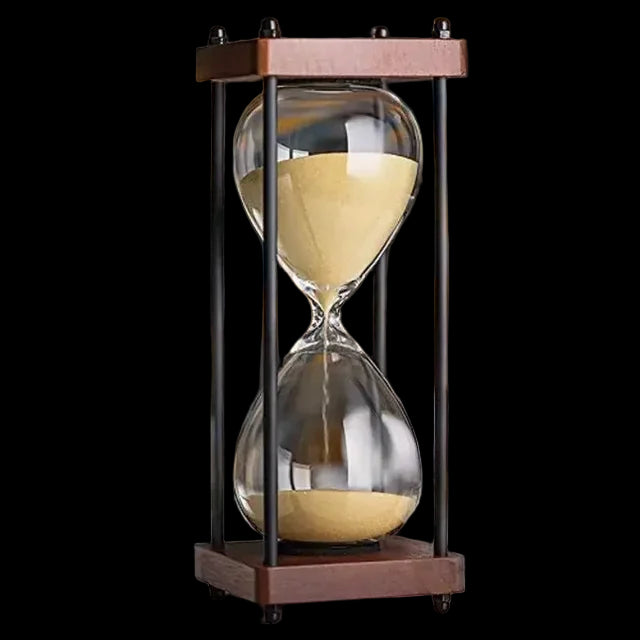 Sand timer on a desk with a blurred background